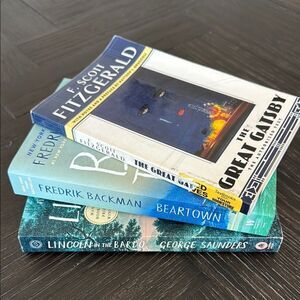 Coffee Table books, Great Gatsby, Lincoln in the Bardo, Beartown, blue, white